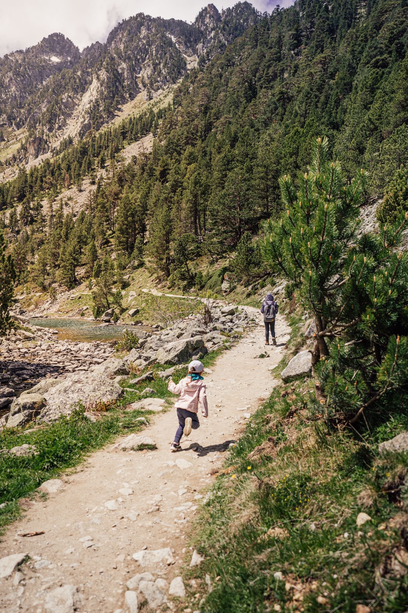 A parent and child on a mountain walk